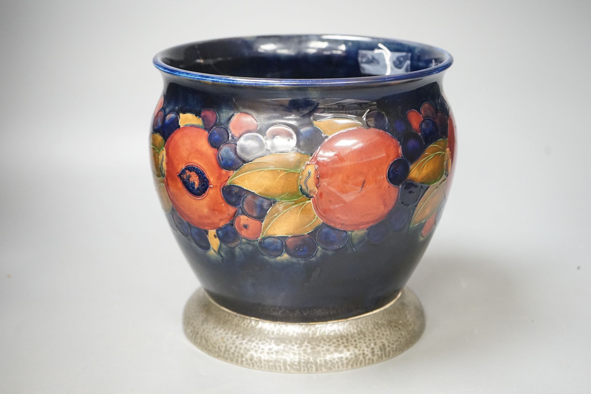 A Moorcroft jardiniere, on hammered pewter plinth, 22cm